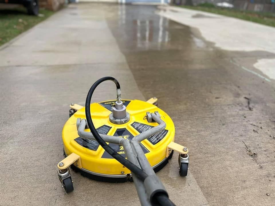 Surface cleaning of concrete driveway